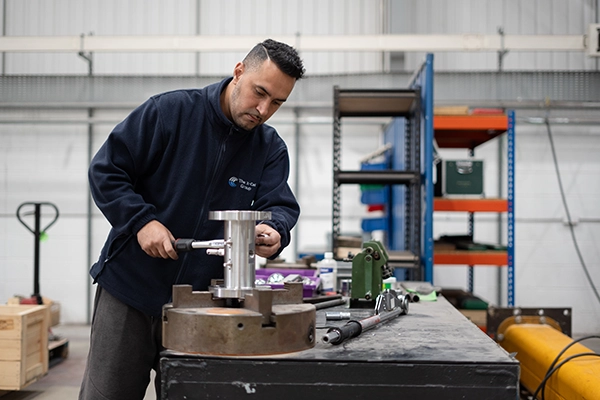 Colson X-Cel employee assembling a valve